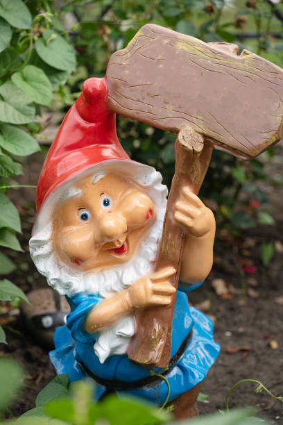 istock garden gnome in the flower bed macro 1422553582