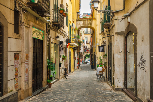 A narrow, rustic and colourful alley in the centre of Salerno, Italy