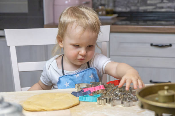 istock Child boy helps in the kitchen. 1422562340