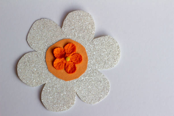 Close-up of a cute children's drawing of a crown. a hand-drawn and orange flower in the traditional colors of the King's Day celebration in the Netherlands.