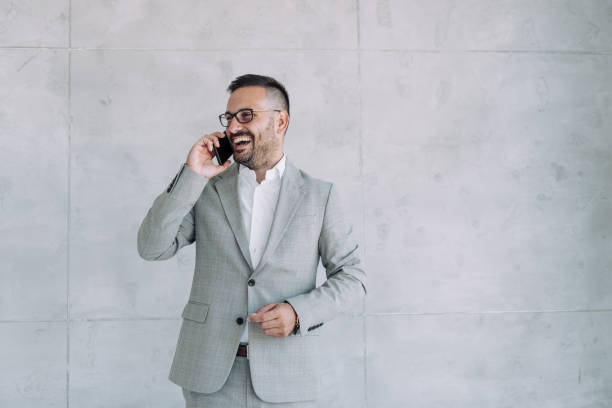 istock Businessman talking on the phone in the office. 1422565496