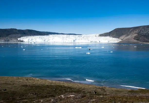 Photo of The stunning Eqi Glacier (Eqip Sermia), a rapidly retreating outlet glacier, north of the disko Bay in Western Greenland