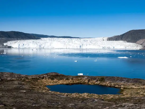 Photo of The stunning Eqi Glacier (Eqip Sermia), a rapidly retreating outlet glacier, north of the disko Bay in Western Greenland