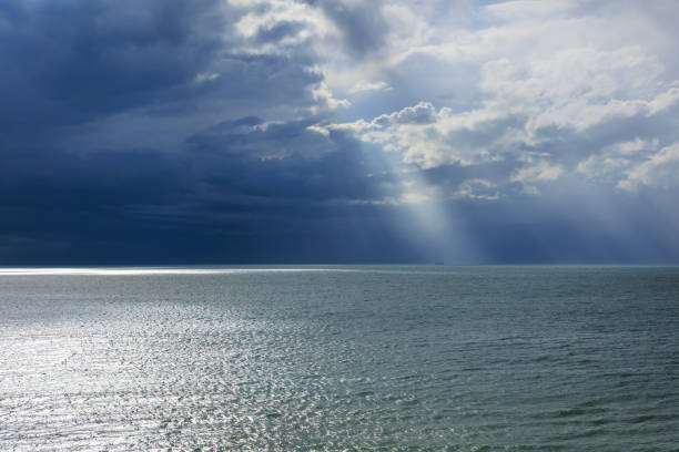 Sun Rays Breaking Through Clouds Over Kagoshima Bay