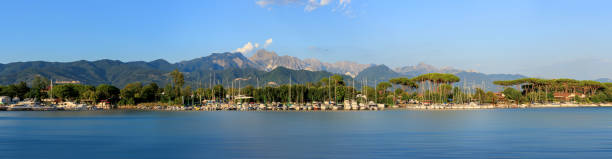 Panorama of Pier harbor waterfront with alps in background