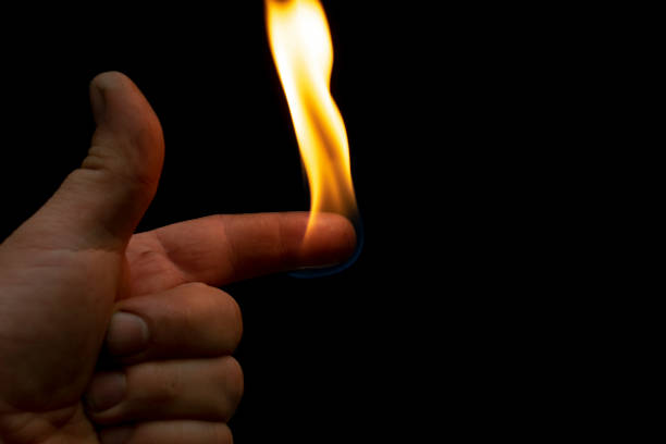 istock flame on a finger on a black background 1422581435