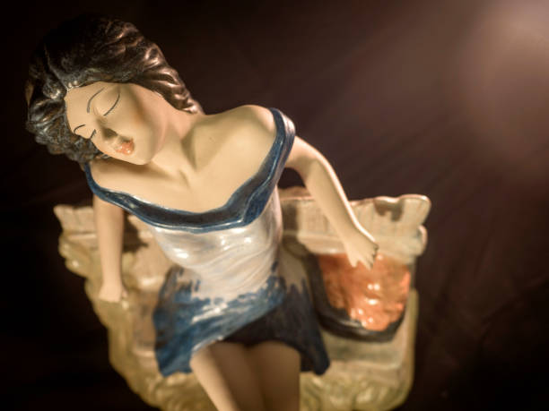 Porcelain doll posing with two flashes scheme at the studio