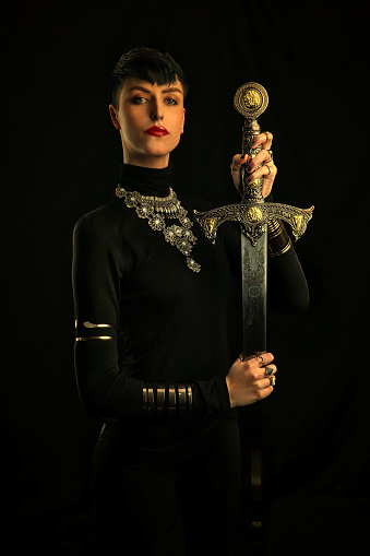 Retro style photo of Warrior Woman holding sword
