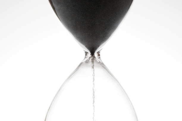 istock Hourglass on a light background. Time is money. Business solutions in time. 1422592712
