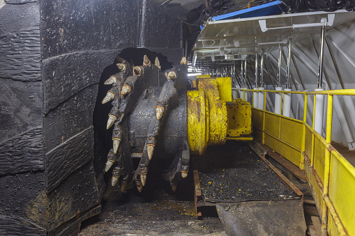Shrearer machine in old closed coal mine. Special equipment for mineral ore mining.