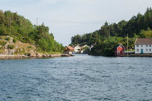 Lindesnes, Norway - July 06 2011: View of houses by the sound at Svinør.