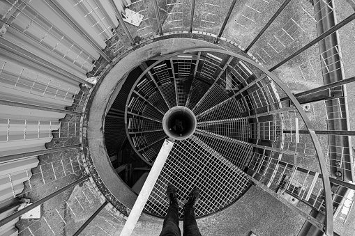 Gothenburg, Sweden - June 06 2022: Looking down a spiral metal staircase.