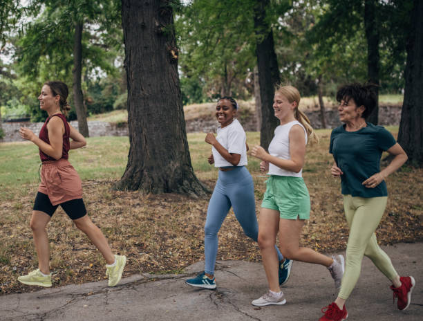 istock Women jogging together in park 1422599730