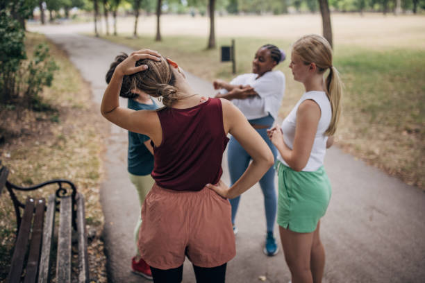 istock Women exercising together in park 1422605491