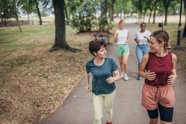 istock Friends jogging in park 1422607513