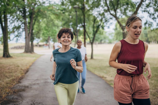 istock Friends jogging in park 1422607547
