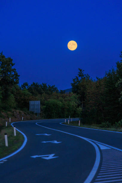 istock Full moon landscape with road 1422607808