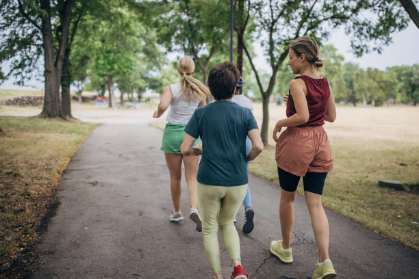 istock Friends jogging in park 1422607854