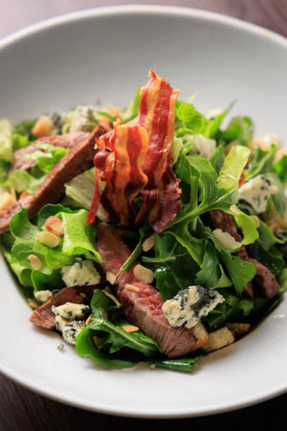 istock Green salad and meat and bacon 1422610199