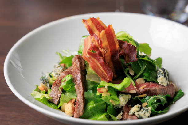 istock Green salad and meat and bacon 1422610203