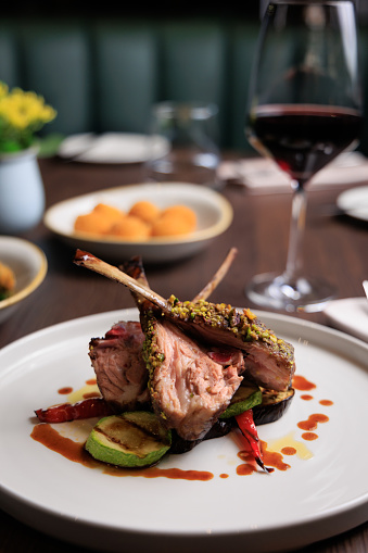 GRILLED LAMB RIB CHOPS with side dish and wine, Gourmet food photography