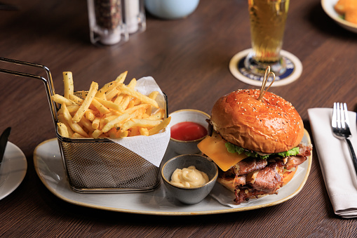 Gourmet Bacon cheese hamburger with French fries dish, Gourmet food photography