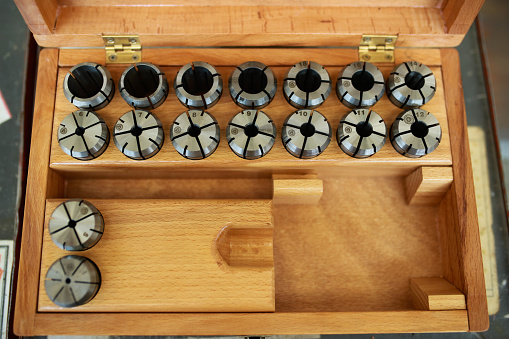 Old wine bottles in a wooden crate.