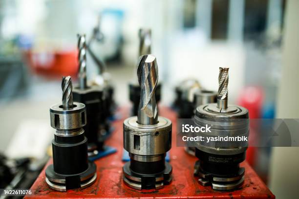 Cutting Tools Used In Cnc Milling Machine End Mills Attached In Tool Holder Stock Photo - Download Image Now