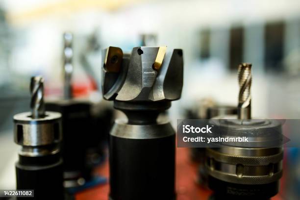 Cutting Tools Used In Cnc Milling Machine Face Milling With Insert End Mill Mounted In Tool Holder Stock Photo - Download Image Now