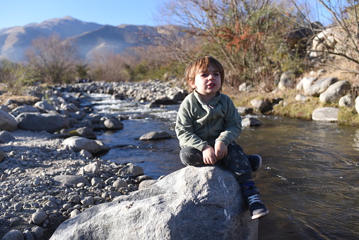 child in a stream