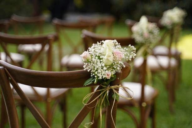 istock wedding day chair with flower on grass 1422613952