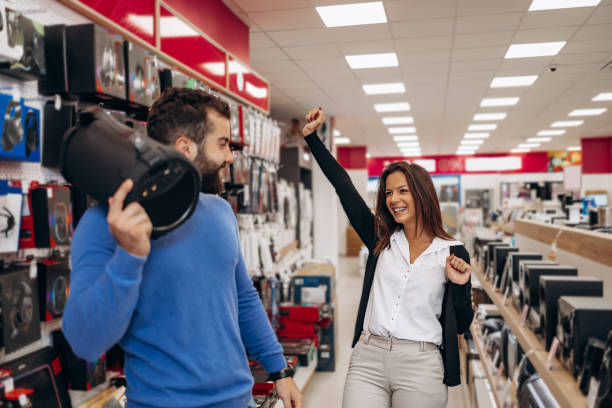 istock Young couple in shopping. 1422628355