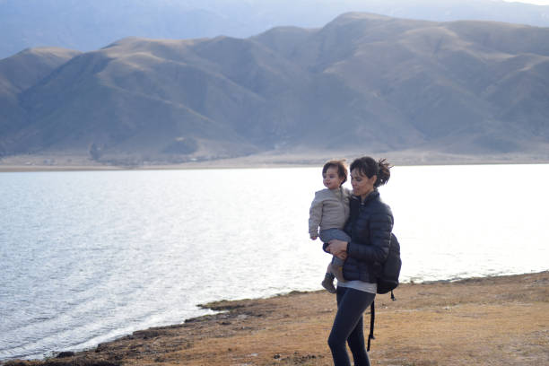 istock mother with son on the riverbank 1422631130