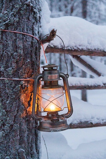 Lamp on post on a snowy day in Finland