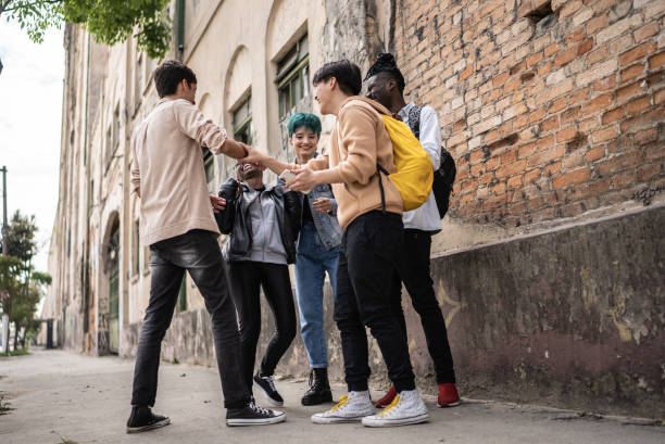 istock Friends talking in the street 1422641456
