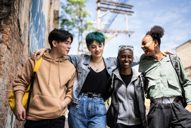 istock Friends walking in the street 1422642375