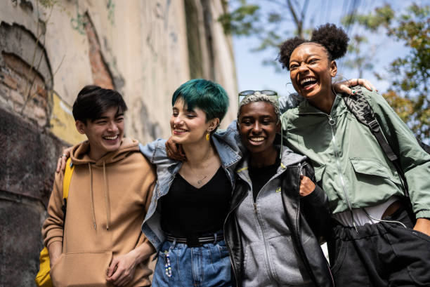 istock Friends walking in the street 1422642919