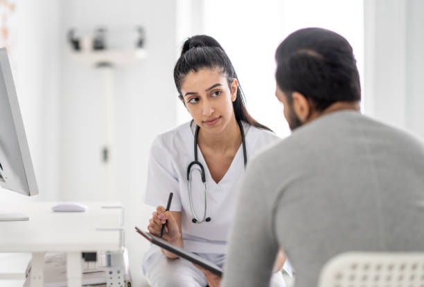 istock Patient consults doctor 1422643310