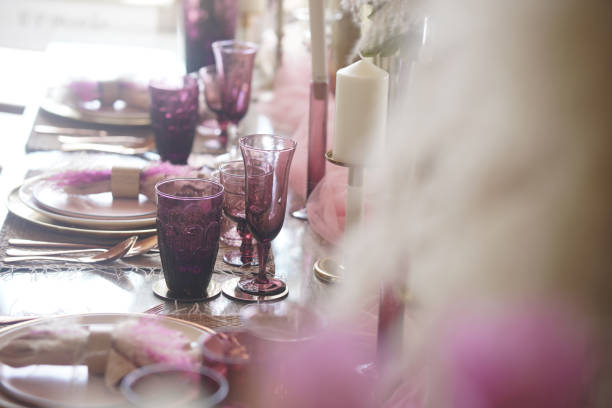 istock glass dishware on dining table. party banquet 1422643536