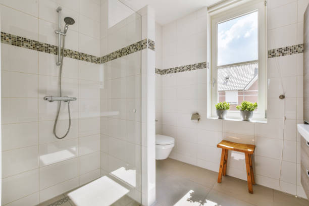 istock Spacious bathroom with white tiles in a modern house 1422644441