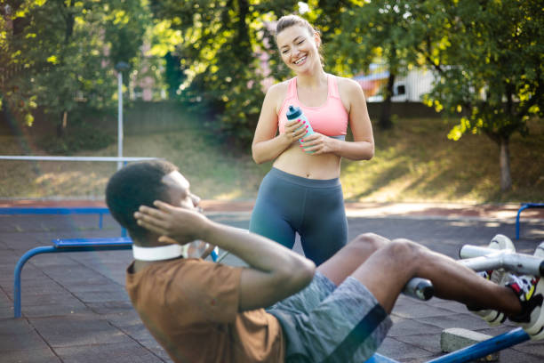 Man and woman in sports wear doing workout
