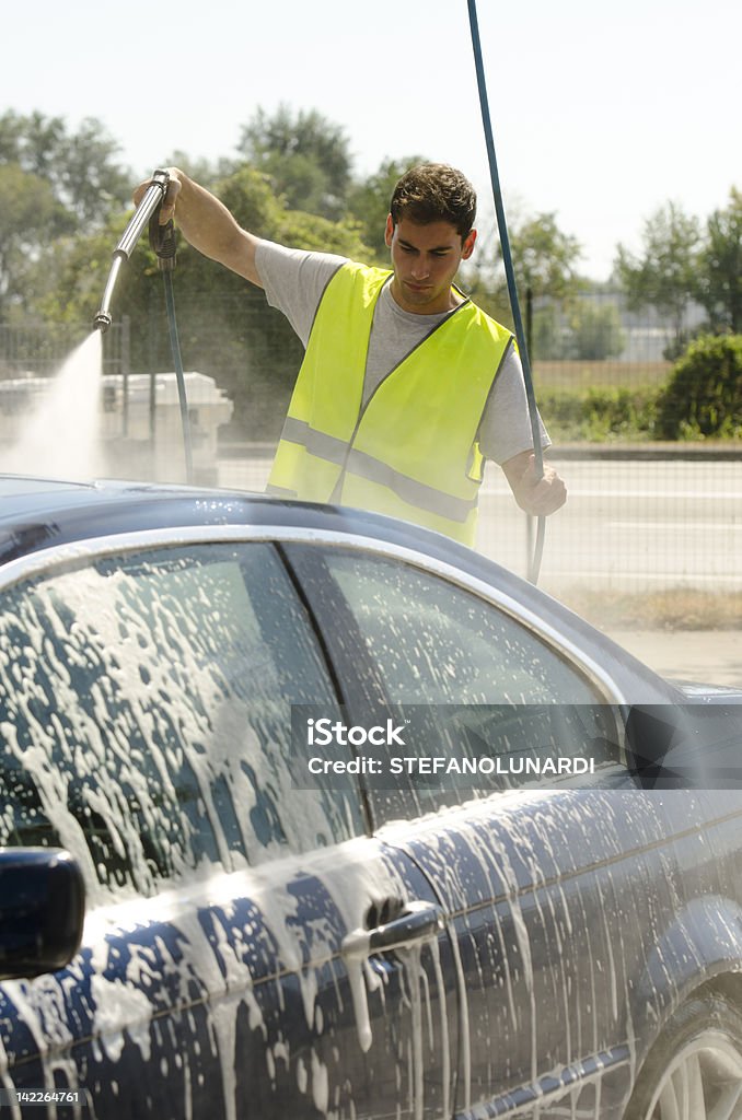 Young Man Working At Car Wash Station Young man working at car wash station 25-29 Years Stock Photo