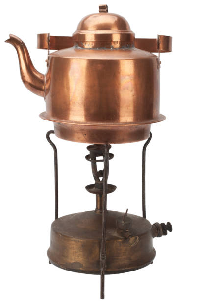 istock Retro vintage bronze primus stove with copper teapot. 1422649432