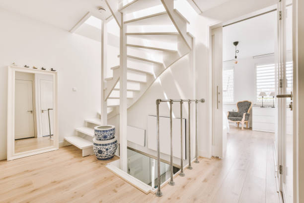 istock A spacious corridor with a spiral staircase leading to the top 1422650576