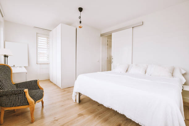 istock A small cozy bedroom with a white bed 1422650578