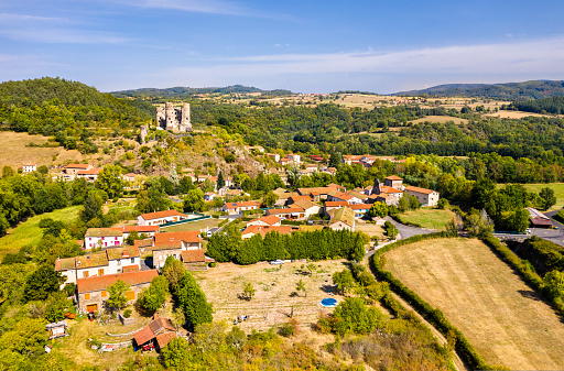 Aerial view of Domeyrat village with its castle in Auvergne, France