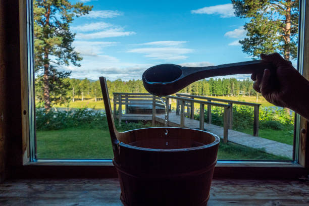 Sorsele, Sweden Sorsele,Sweden A water bucket and laddle in a sauna with a window over Swedish Lappland. swedish sauna stock pictures, royalty-free photos & images