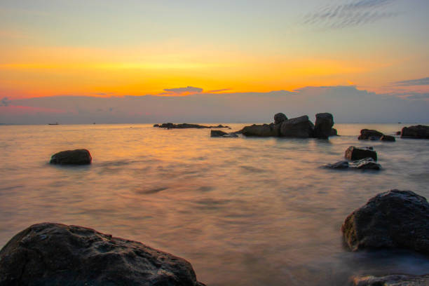 istock sunset at tanjung siambang sea 1422656520