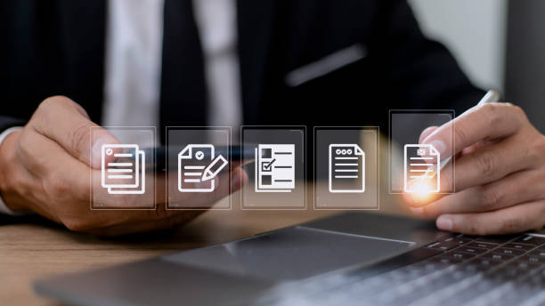 istock Paperless workplace ideas, e-signing, electronic signature, document management. A businessman signs an electronic document on a digital document on a virtual screen. 1422657637