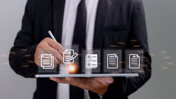 istock Paperless workplace ideas, e-signing, electronic signature, document management. A businessman signs an electronic document on a digital document on a virtual screen. 1422657643